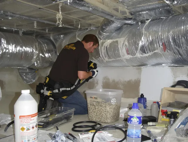 Winthrop Air Duct Cleaning specialist performing professional mold removal from air ducts in Winthrop