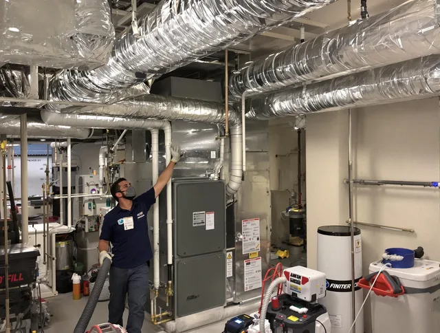 Winthrop Air Duct Cleaning specialist performing thorough furnace duct cleaning in a Winthrop residence