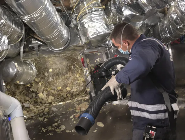Winthrop Air Duct Cleaning specialist operating negative pressure cleaning equipment for thorough duct maintenance in Winthrop