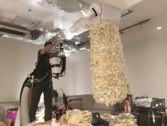 Winthrop Air Duct Cleaning technician performing precision vacuum insulation removal in a residential property in Winthrop